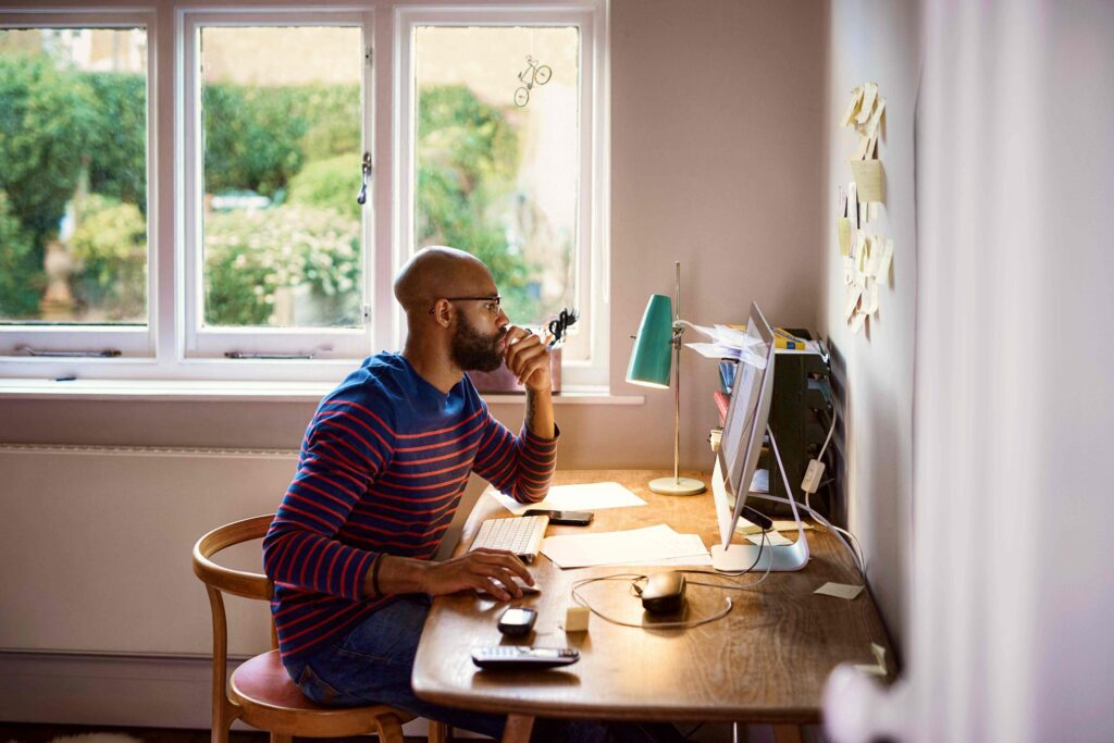 "Focused digital marketing student or web developer working from home on a desktop setup – ideal for HIDM blogs on online learning, remote jobs, and digital career growth"