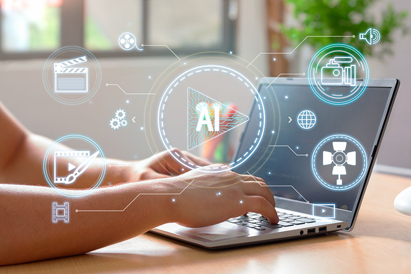 Person working on a laptop with futuristic AI video editing icons overlayed on screen. The image represents artificial intelligence in digital content creation, video marketing, and media automation – key skills taught at HIDM (Hisar Institute of Digital Marketing) for modern marketers and content creators.