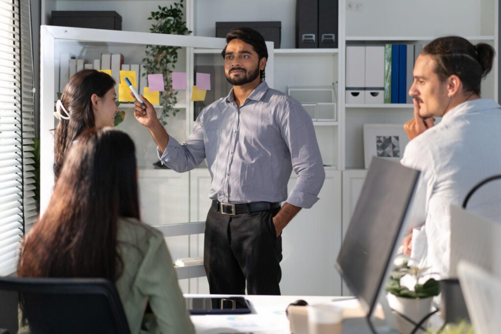 Indian digital marketing manager leading marketing team meeting