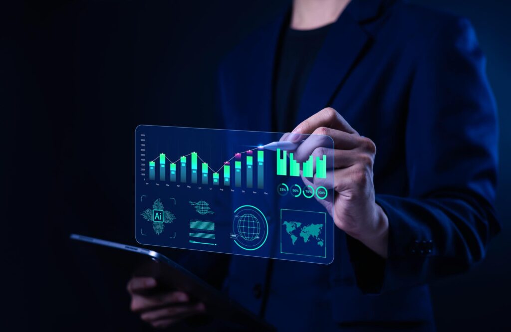 Marketing professional reviewing predictive analytics charts and AI-generated business insights on a digital dashboard.