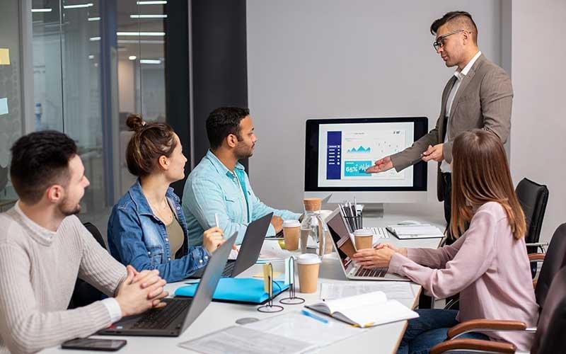 Successful Indian digital marketing agency owner in modern office environment