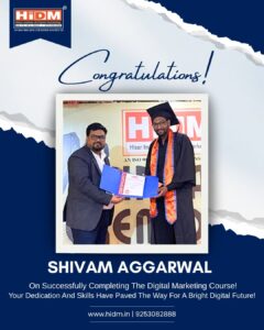 Trainer congratulating a student after awarding a digital marketing certificate.
