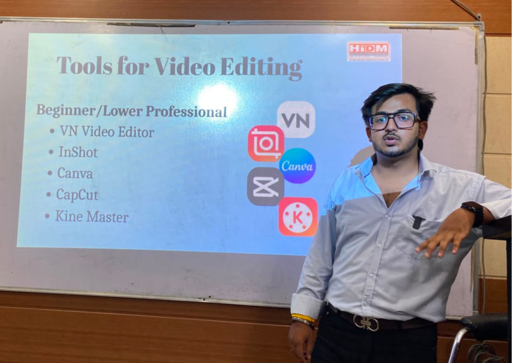 Goutam presenting beginner-friendly video editing tools including VN Video Editor, InShot, Canva, CapCut, and KineMaster during a seminar at HiDM.