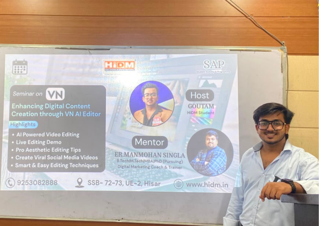 Goutam standing beside the seminar introduction slide on Enhancing Digital Content Creation through VN AI Editor at HiDM.