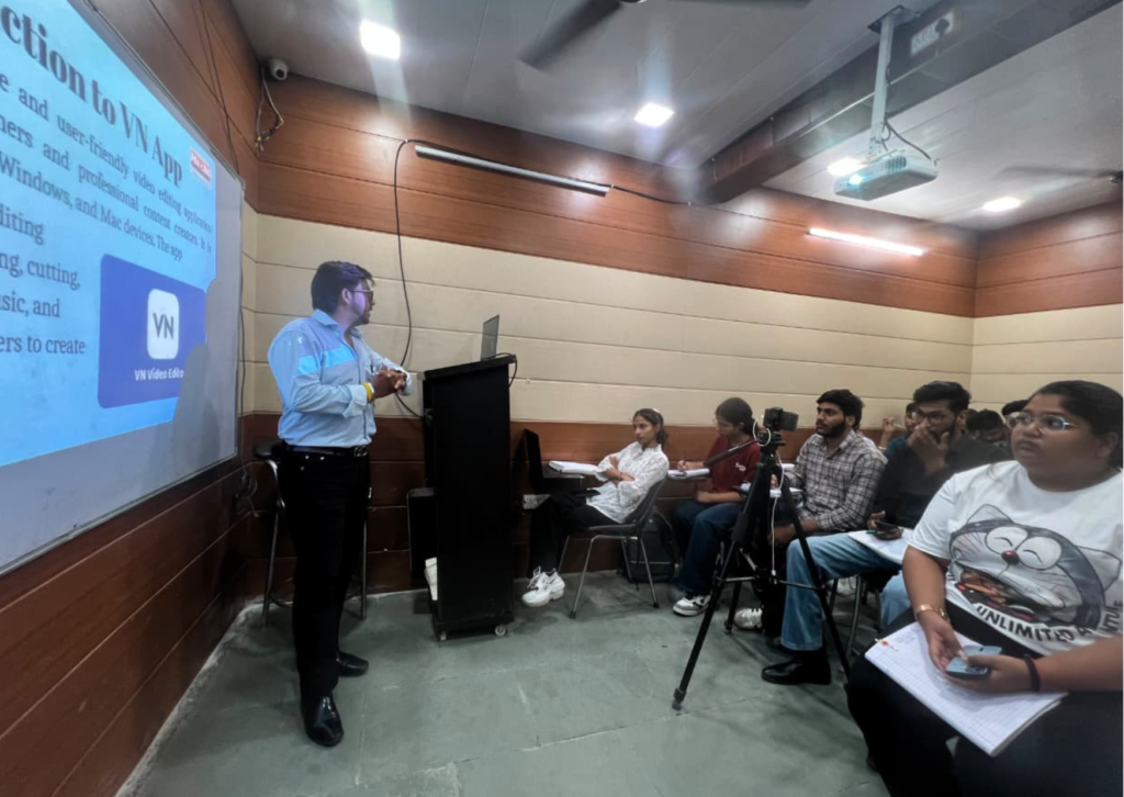 Goutam demonstrating the features of the VN Video Editor application during a live seminar while students observe the presentation.
